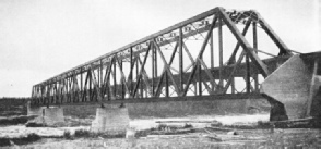 A substantial steel girder structure carries the Hudson Bay Railway across the Nelson River at Kettle Rapids