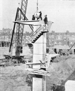 POURING THE CONCRETE with the top diving platform in position