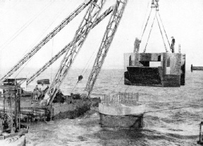 SPECIALLY DESIGNED CONCRETE CAPS were fitted to the upper end of the sunken concrete cylinders