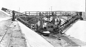 A WOODEN JUMBO, or movable scaffold, straddled the canal section of the Colorado aqueduct