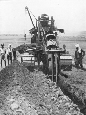 A DITCHING MACHINE AT WORK on the Iraq pipe line