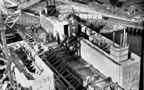 GRANITE-FACED CONCRETE PYLON of the Sydney Harbour bridge in course of construction at Milsons Point