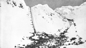 Two lines of gold-seekers climbing over the Chilcoot Pass on their way to the Klondike River