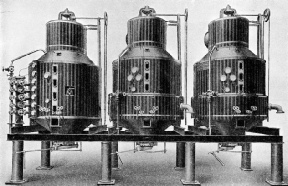 VACUUM PANS are large vertical cylinders in which the sugar cane juice is boiled