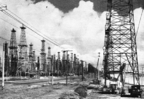 RAILWAY AND ROAD IN AN OILFIELD on the ocean front near Los Angeles