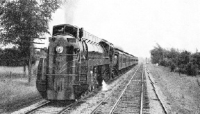 AT THE HEAD OF A PASSENGER TRAIN, No. 6401 is one of a class of five which are among the largest and heaviest streamlined locomotives in the world