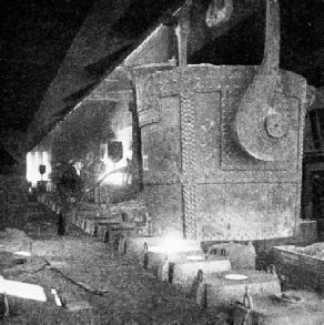 TEEMING THE MOLTEN STEEL from the open hearth furnaces into moulds