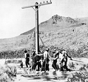 TELEPHONE POLE SETTING IN A SALT SINK near Stone House, Nevada