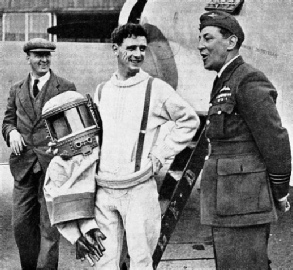 FLIGHT-LIEUT. M. J. ADAM and the pressure suit which he wore on his record-breaking flights