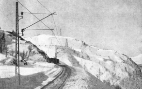 OVER SNOWCLAD MOUNTAINS the track of the Iron Ore Railway was built in the face of all the privations and dangers of Arctic weather