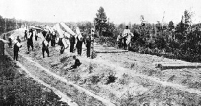 WORKERS CARRYING SLEEPERS for the new Trans-Siberian Railway