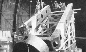 THE WESTERN MEMBER OF THE POLAR AXIS of the 100-in Hooker telescope being swung into position