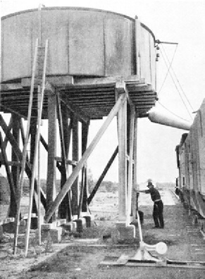 LARGE WATER TANK from which locomotives draw water on the long journeys across the arid regions of the Australian continent