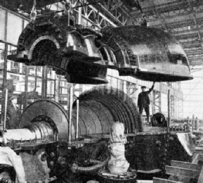 THE TOP HALF of a turbine casing being lowered into place