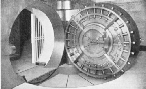 TWENTY-FOUR ROUND BOLTS are incorporated in this circular door of a safe deposit