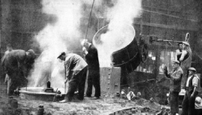 POURING MOLTEN BRONZE into the mould of one of the Queen Mary’s propellers