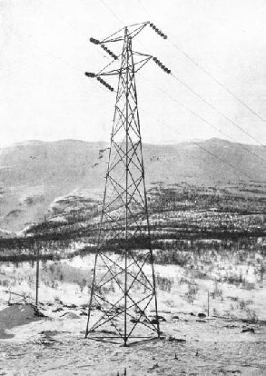 ONE OF THE STEEL PYLONS which carry the transmission fines of the Iron Ore Railway