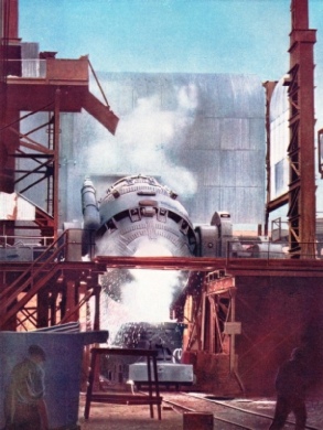 POURING WHITE HOT STEEL from a Bessemer converter into a ladle