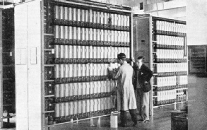 A SECTION OF LONDON’S FIRST AUTOMATIC EXCHANGE—at Holborn. The apparatus is pare of the Tandem exchange which transmits calls from one manual exchange to another, thus effecting a considerable saving of time.