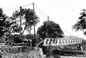 TWO LIGHT DERRICKS and simple tackle served to launch the completed unit span in position