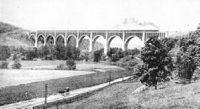 TEN CONCRETE SPANS of 180 feet and two of 100 feet carry the Delaware, Lackawanna and Western Railroad across Tunkhannock Creek