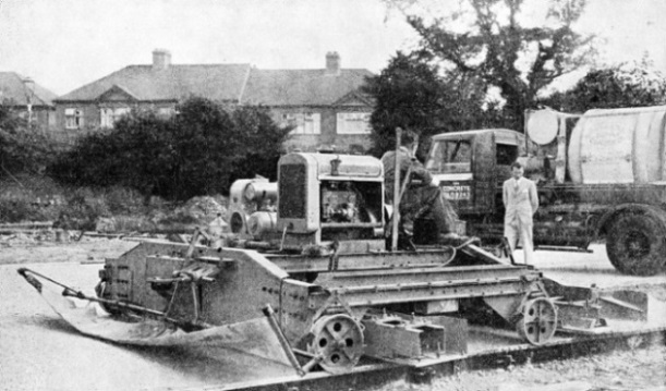 VIBRATORY CONCRETE FINISHING MACHINE at work on a road