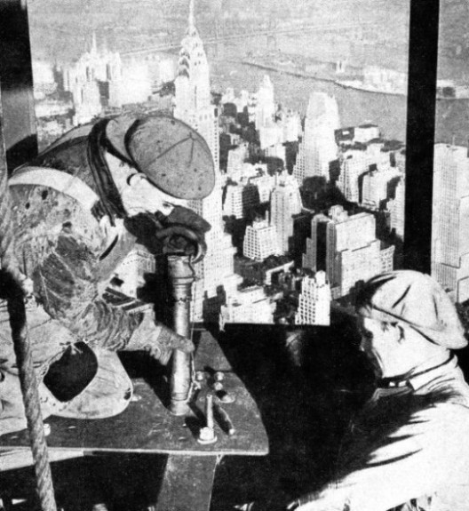 RIVETERS in a perilous position at the top of the Empire State Building
