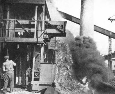 RED-HOT COKE is emptied directly from the ovens