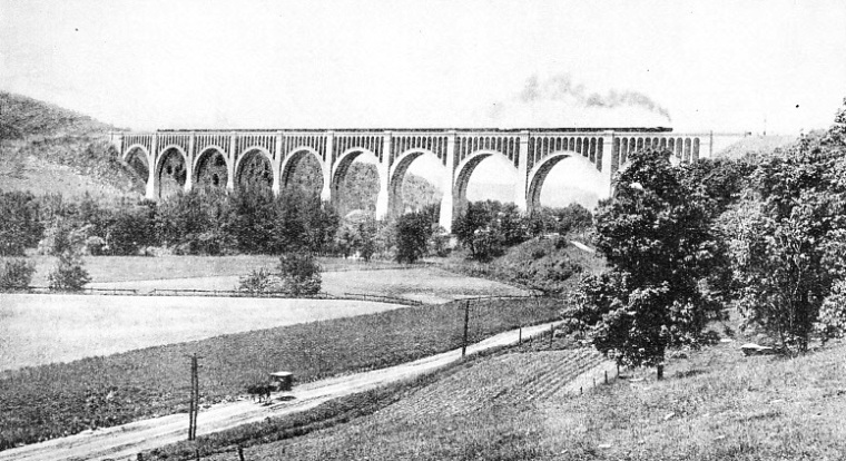 TEN CONCRETE SPANS of 180 feet and two of 100 feet carry the Delaware, Lackawanna and Western Railroad across Tunkhannock Creek