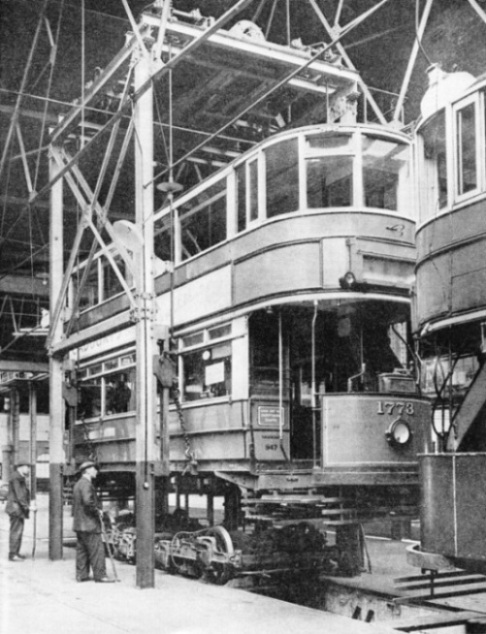REMOVING THE BODY OF A TRAMWAY CAR from its trucks