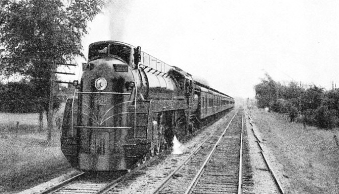 AT THE HEAD OF A PASSENGER TRAIN, No. 6401 is one of a class of five which are among the largest and heaviest streamlined locomotives in the world