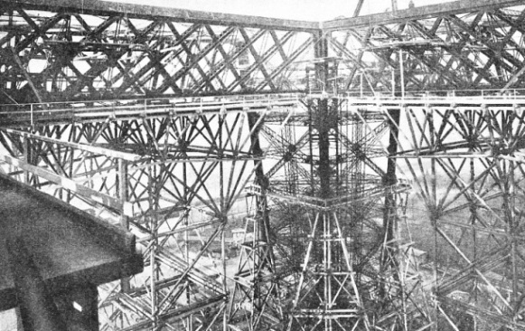 THE INTRICATE MASS OF IRONWORK at the level of the first platform of the Eiffel Tower