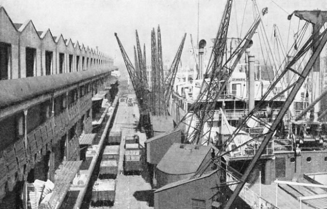 BALES OF INDIAN COTTON being discharged at Manchester Docks