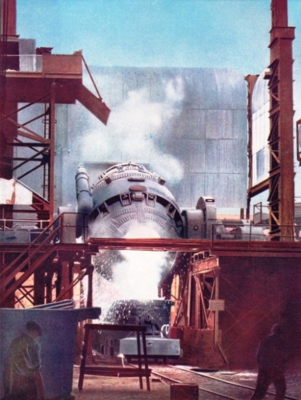 POURING WHITE HOT STEEL from a Bessemer converter into a ladle