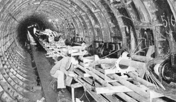 ELECTRIC CABLES are carried beneath the River Thames in a tunnel from Deptford Power Station