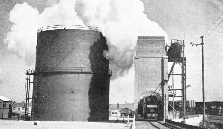 BILLOWING CLOUDS OF STEAM rise from the quenching house when a load of burning coke is being quenched