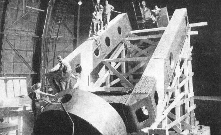 THE WESTERN MEMBER OF THE POLAR AXIS of the 100-in Hooker telescope being swung into position