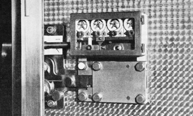 QUADRUPLE TIME LOCK MECHANISM incorporated on the door of a modern safe deposit