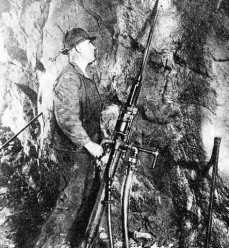 Miners drill holes for blasting silver-bearing ore in the mines near Butte Montana