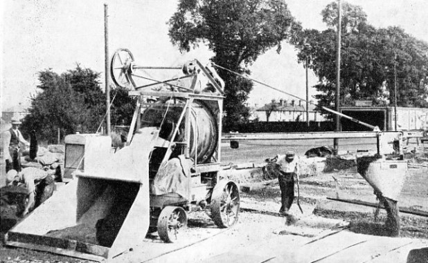 POURING A CONCRETE ROAD BY MACHINE
