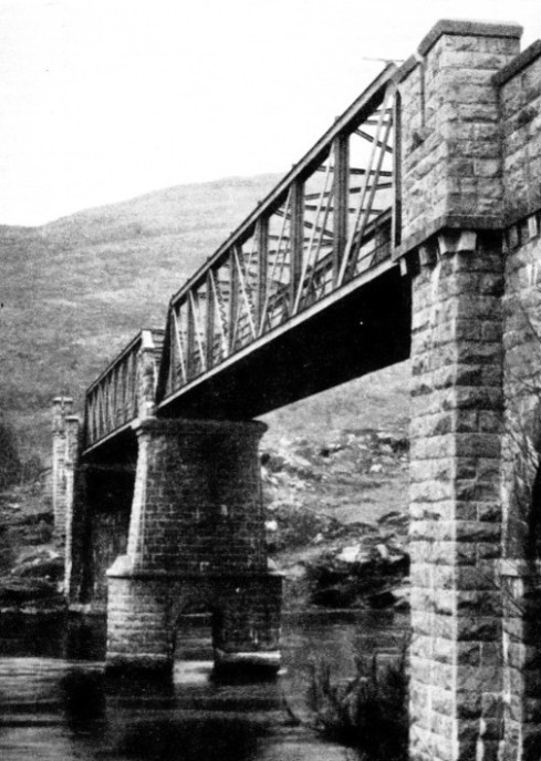 LATTICE GIRDERS, resting on massive piers