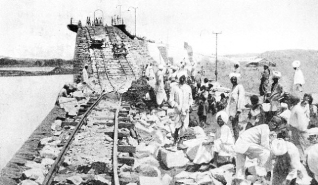 MASONS FASHIONING STONES for the parapet of the Krishnaraja Sagara Dam, near Mysore