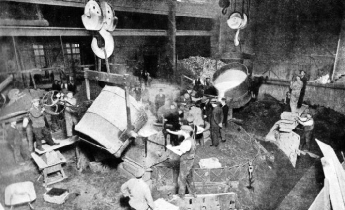 TWO LADLES OF MOLTEN BRONZE pour the metal into the mould of a large propeller