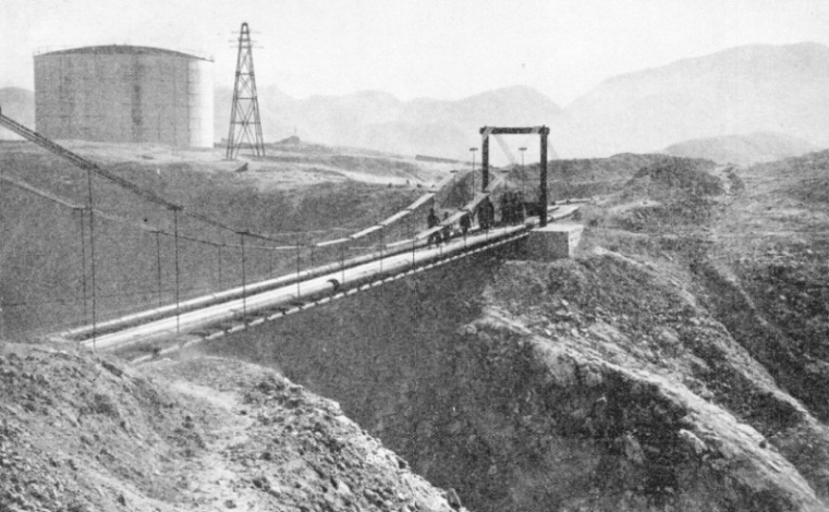 ACROSS A DEEP RAVINE near Masjid-i-Sulaiman the oil pipe line is carried on a suspension bridge